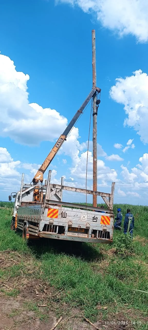 Crane Rigging and Pole Planting in Field Corridor